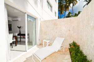 outdoor patio with chaise lounge chair in ground floor condo at The SANCTUARY at Los Corales