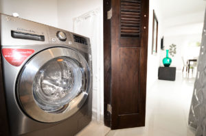 laundry room in ground floor condo at The SANCTUARY at Los Corales