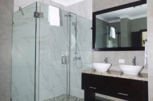 double sinks next to standing shower in bathroom in penthouse condo at The SANCTUARY at Los Corales