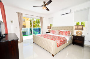 bedroom with balcony in second floor condo at The SANCTUARY at Los Corales