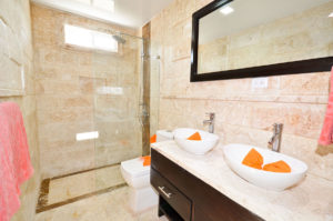 bathroom with standing shower in second floor condo at The SANCTUARY at Los Corales
