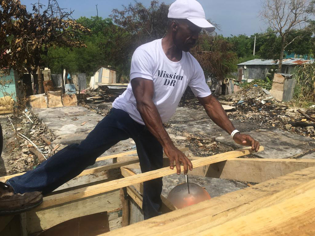 volunteer rebuilding a home in the Dominican Republic