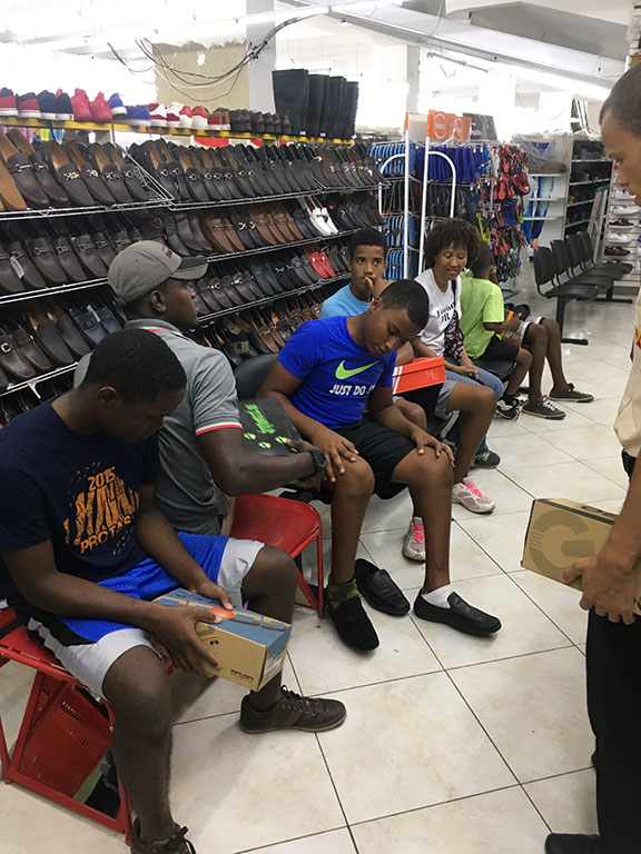 group of boys shopping for shoes