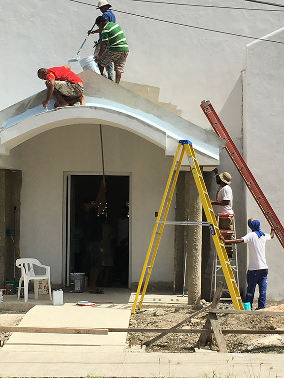 Painting a church in El Seibo