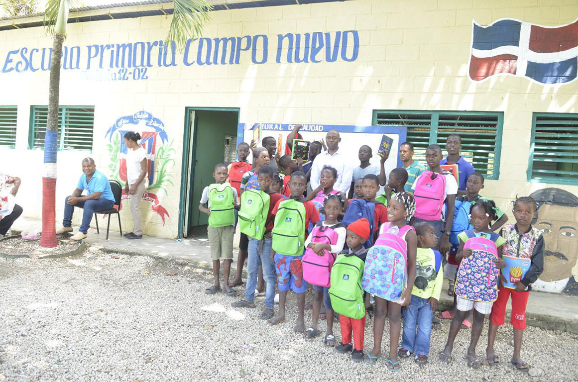 New backpacks and school supplies for children in sugarcane community